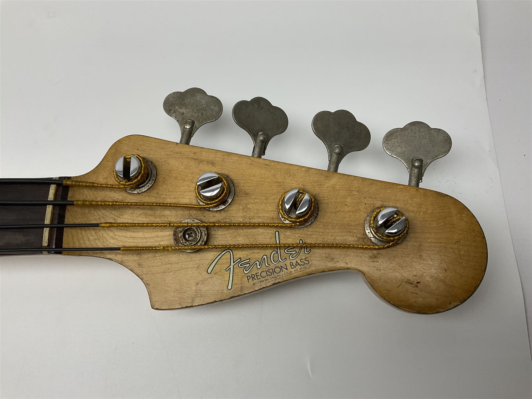 Early 1960s American Fender Precision electric bass guitar with original three-tone sunburst finish and faux tortoiseshell scratch plate; rosewood fretboard; all original fittings including chromium plated bridge and pick-up covers, finger rest, 'pots' and machines, dated on end of neck 5NOV62C, serial no.91625; L115cm overall; in Selmer simulated reptile skin covered carrying case. Sold with non-transferrable CITES A10 licence, certificate no.23GBA10CNKKEB, serial no.441200, dated 30th August 2023. Also included are original 1960s photographs of the band 'The Rascals' and photocopies of newspaper cuttings advertising their forthcoming performances along with a photocopy of a photograph of their television appearance on 'Opportunity Knocks' in 1967/8 (coming second to Mary Hopkins). In addition there is a reel-to-reel tape recording and USB stick of the band playing and two sheets of biographical information. Auctioneer's Note: The guitar was ordered by Trevor Parker from Pat Cornell's Music Shop, Spring Bank, Hull and imported from the USA in 1962, well before it was available in the UK. Trevor was the bass guitarist of The Rascals from Hull, later The Ides of March, who supported artists such as Elton John on the Hull circuit. Trevor played the guitar extensively until 1969 when The Rascals disbanded, he got married to Maureen and settled down to family life. Trevor sadly passed away in 2017, and after being in store for fifty-four years his widow has decided it is time for his guitar to be sold.