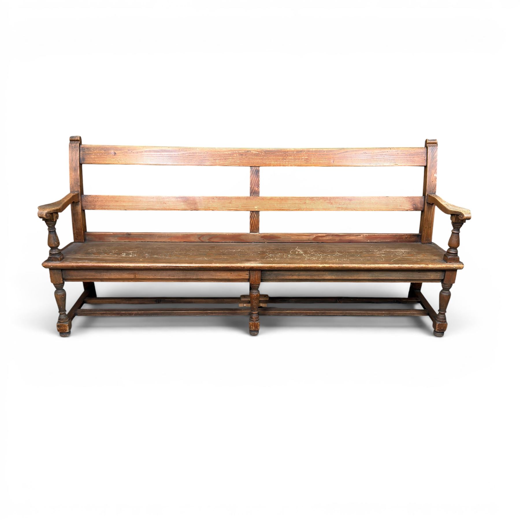 Early 20th century pine and oak bench seat, stained pine rail back frame with shaped oak arms