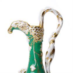 Pair of mid-19th century Jacob Petit ewers, in the Rococo Revival style, hand-painted with panels of flowers on a green ground and heightened profusely with gilt, JP mark in underglaze blue to base, H25cm