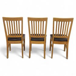 Contemporary set of six light oak dining chairs with faux leather cushion seats 