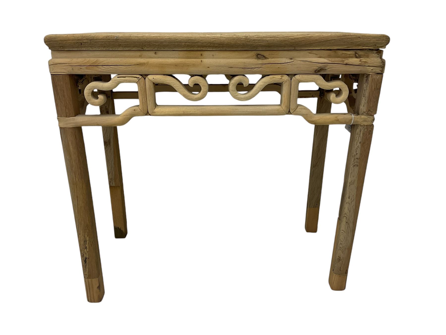 Chinese Ming design elm side table, rectangular top over shaped frieze rails, on square supports with curved outer edge 