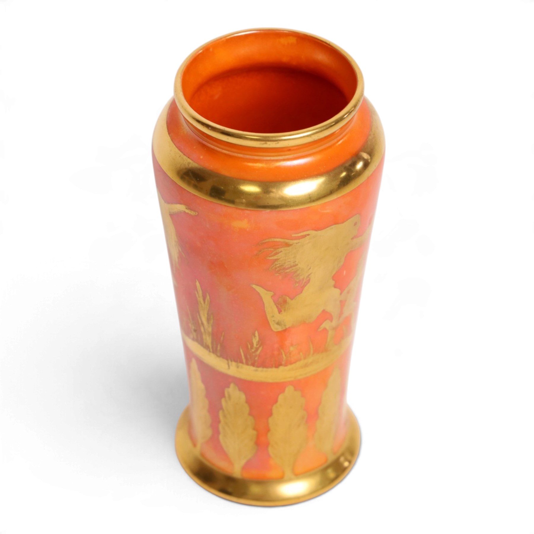 Royal Doulton orange lustre vase, decorated  with gilt figure hunting a stag, above a  boarder of trees, H14cm