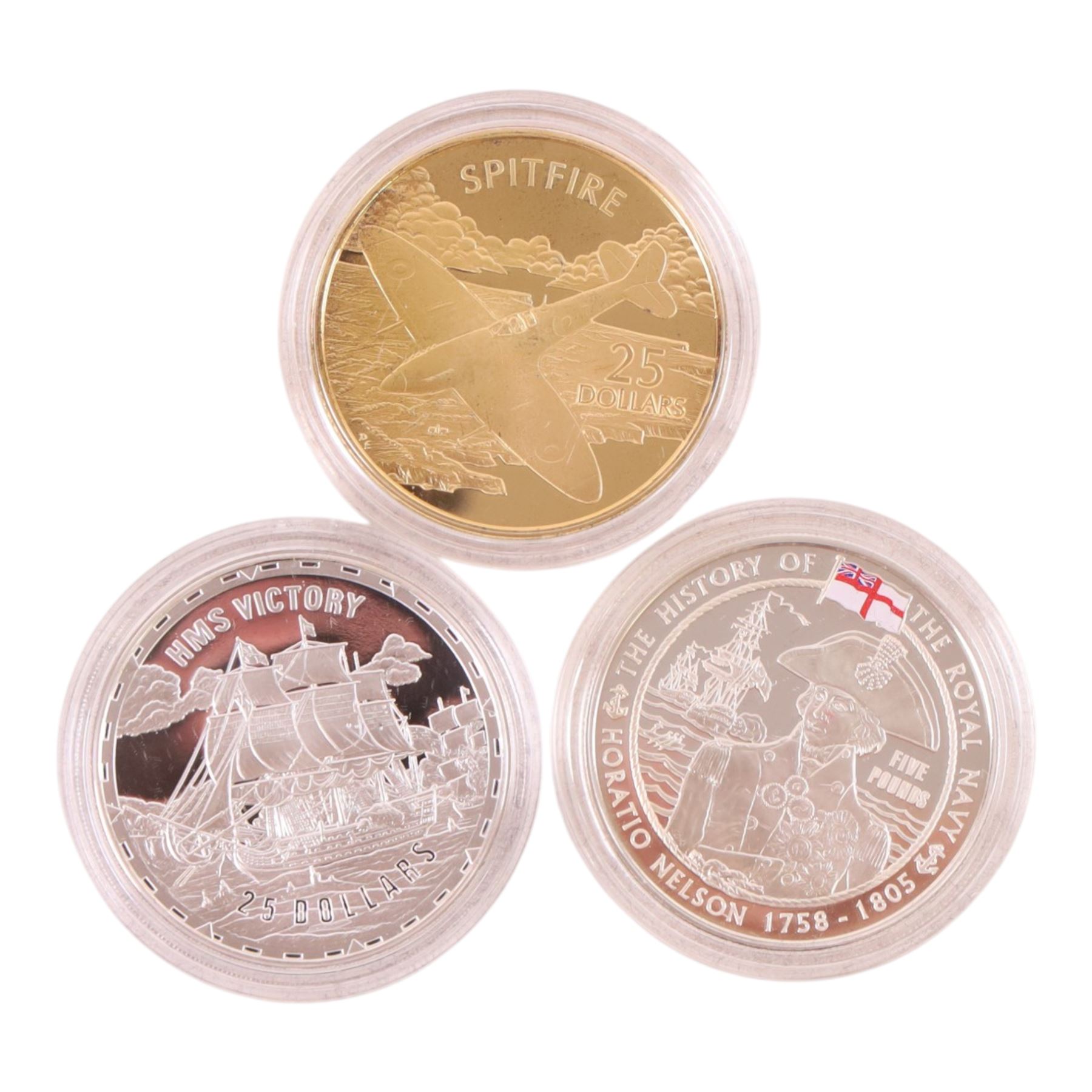 Three Royal Mint silver proof coins, comprising Queen Elizabeth II Guernsey 2003 'Nelson' five pound, Solomon Islands 2005 'HMS Victory', and Solomon Islands 2005 'Supermarine Spitfire', with certificates
