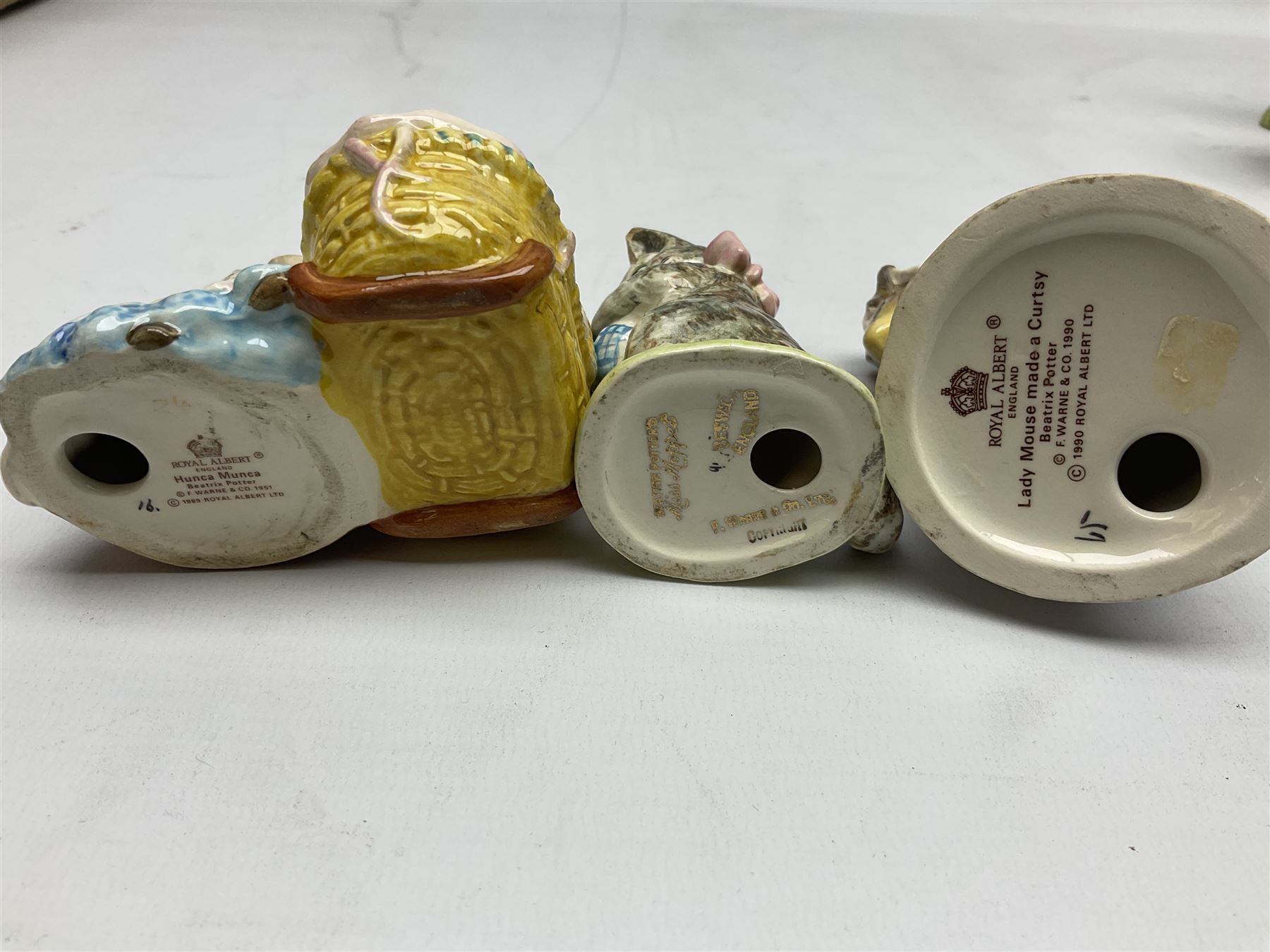 Six Beswick Beatrix Potter figures, comprising Miss Moppet, Tommy Brock, Peter Rabbit, Cecily Parsley, Mr Drake Puddle-Duck, Amiable Guinea Pig, together with four Royal Albert figures, Hunca Munca, Lady Mouse made a curtsy, Little Pig Robinson and Mr McGregor, all with printed mark beneath  (10)