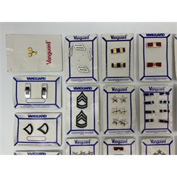Fifty US rank badges and trade badges; WW2 and Vietnam period; predominantly on sale cards