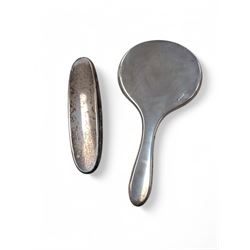 Silver mounted hand mirror and clothes brush, both hallmarked 