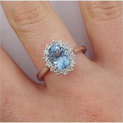 18ct white gold oval aquamarine and diamond cluster ring, hallmarked, aquamarine approx 1.00 carat, total diamond weight approx 0.30 carat
