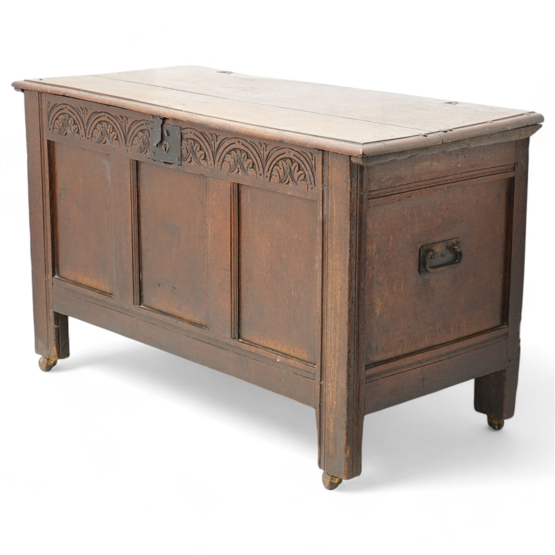 18th century oak blanket box, moulded rectangular hinged lid over lunette carved frieze rail and panelled front, moulded frame and panelled sides fitted with carrying handles, on stile supports