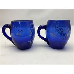 Pair of Victorian cobalt blue glass cups with gilt and painted decoration, entitled Hope's the Balm of Life and Love me as I Love Thee, H8.5cm