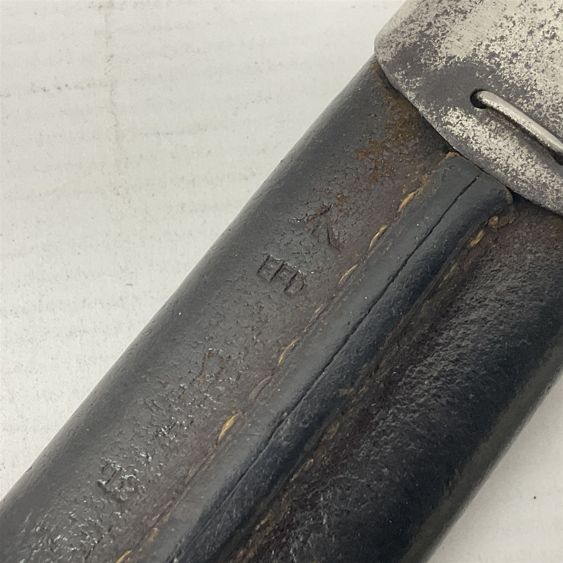 WW1 British pattern 1907 bayonet in polished condition with 43cm fullered steel blade by Sanderson, various marks to ricasso including date 12-14; in steel mounted leather covered scabbard L58cm overall