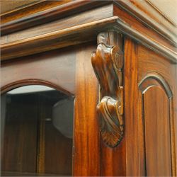 Victorian revival hardwood dresser cabinet, projecting moulded cornice above three glazed doors with shaped tops enclosing shelves, moulded top over three drawers and three panelled cupboard doors, flanked by applied carved brackets, on plinth base
