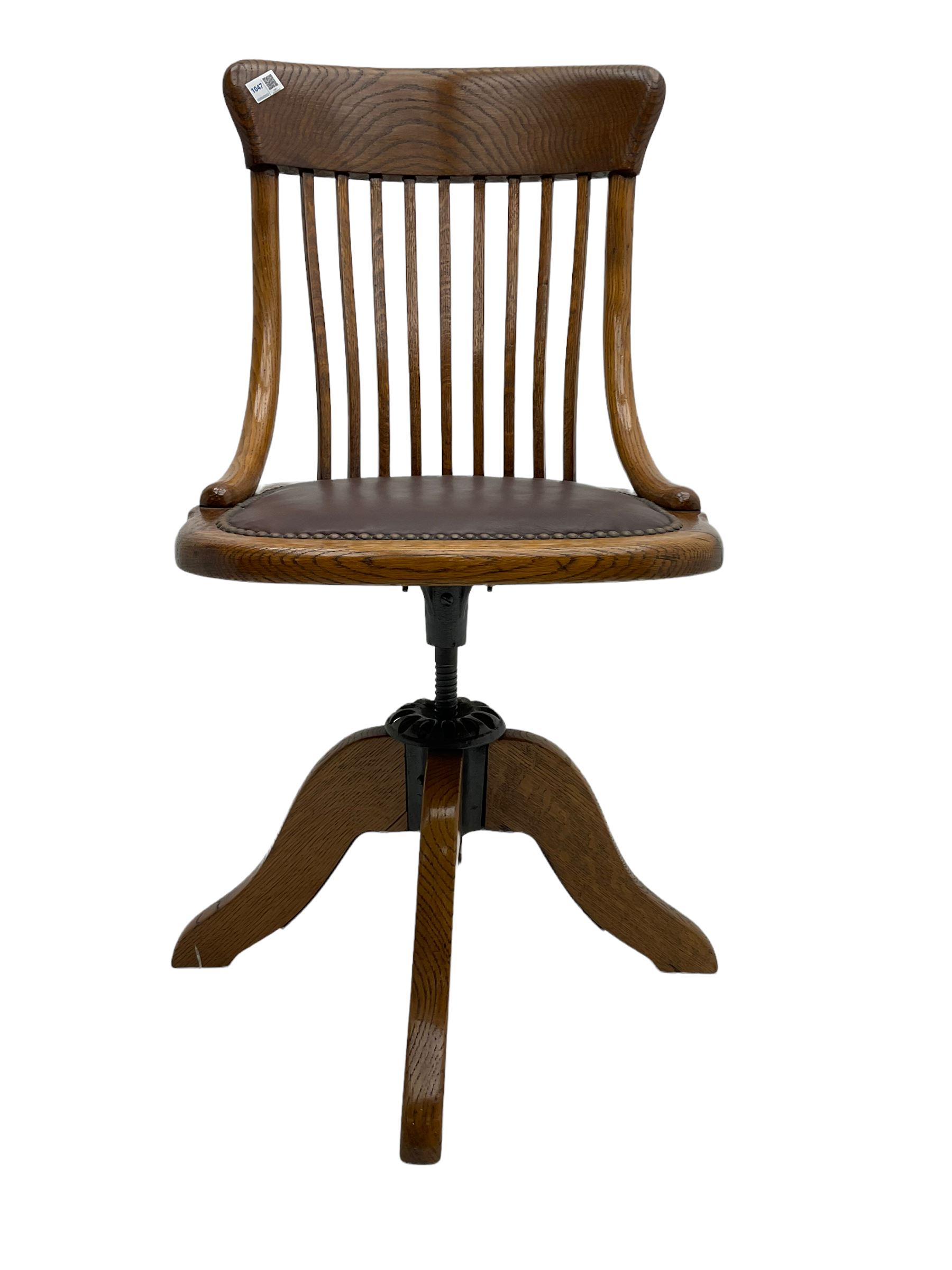 Early 20th century office oak adjustable swivel chair with studded leather seat