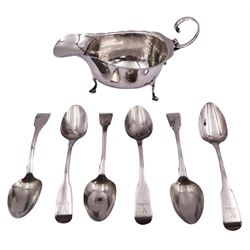Matched set of six George III silver Fiddle pattern teaspoons, hallmarked Thomas Hayter, London 1814, and Thomas & George Hayter, London 1818, and a 20th century silver sauce boat of typical form with flying scroll handle, upon three hoof feet, hallmarked Asprey & Co Ltd, hallmarks heavily worn and not legible, approximate total weight 6.92 ozt (215.5 grams)