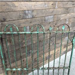 19th century French cast iron garden gate, finished in green rustic paint, bar form with hoop and spear top, with loop hinge brackets