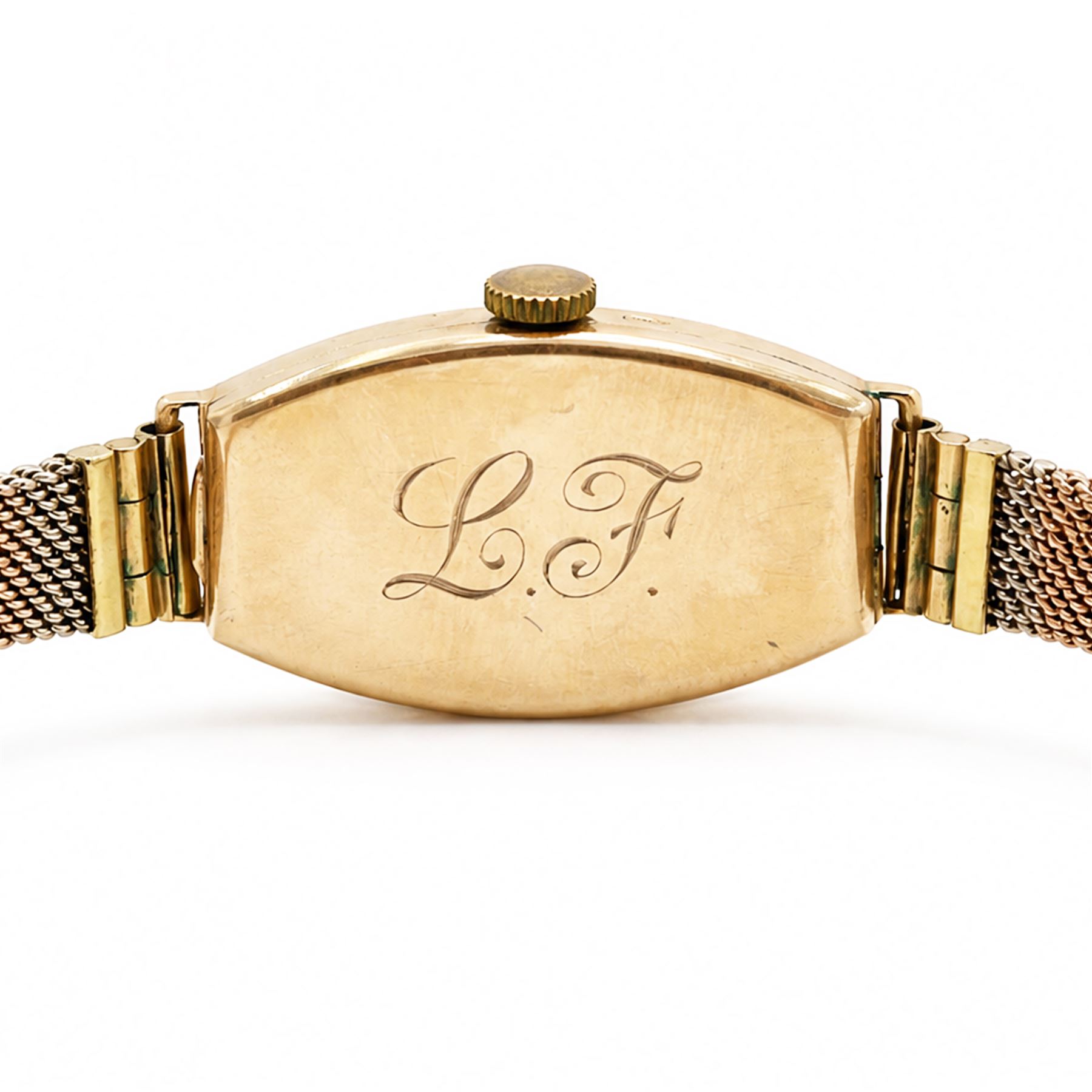 Omega early 20th century ladies 9ct rose gold manual wind wristwatch, silvered dial with Arabic hour markers, back case engraved with initials 'L.F', Edinburgh import mark 1931, on tri-coloured gold bracelet, with adjustable clasp, stamped 9ct