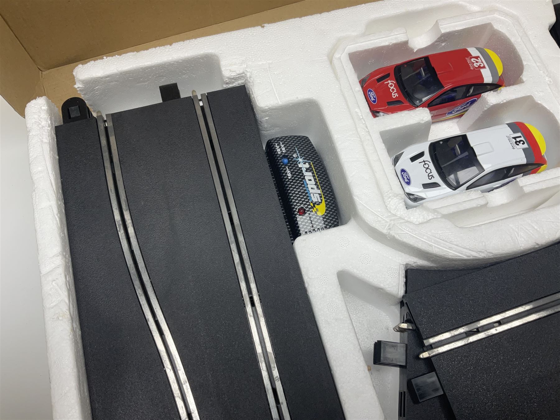Scalextric - Formula One set with McLaren Mercedes and Williams BMW cars; and Speed Extreme set with Ford Focus cars; both boxed with accessories and paperwork; and Parker Pro-Action football game; boxed (3)