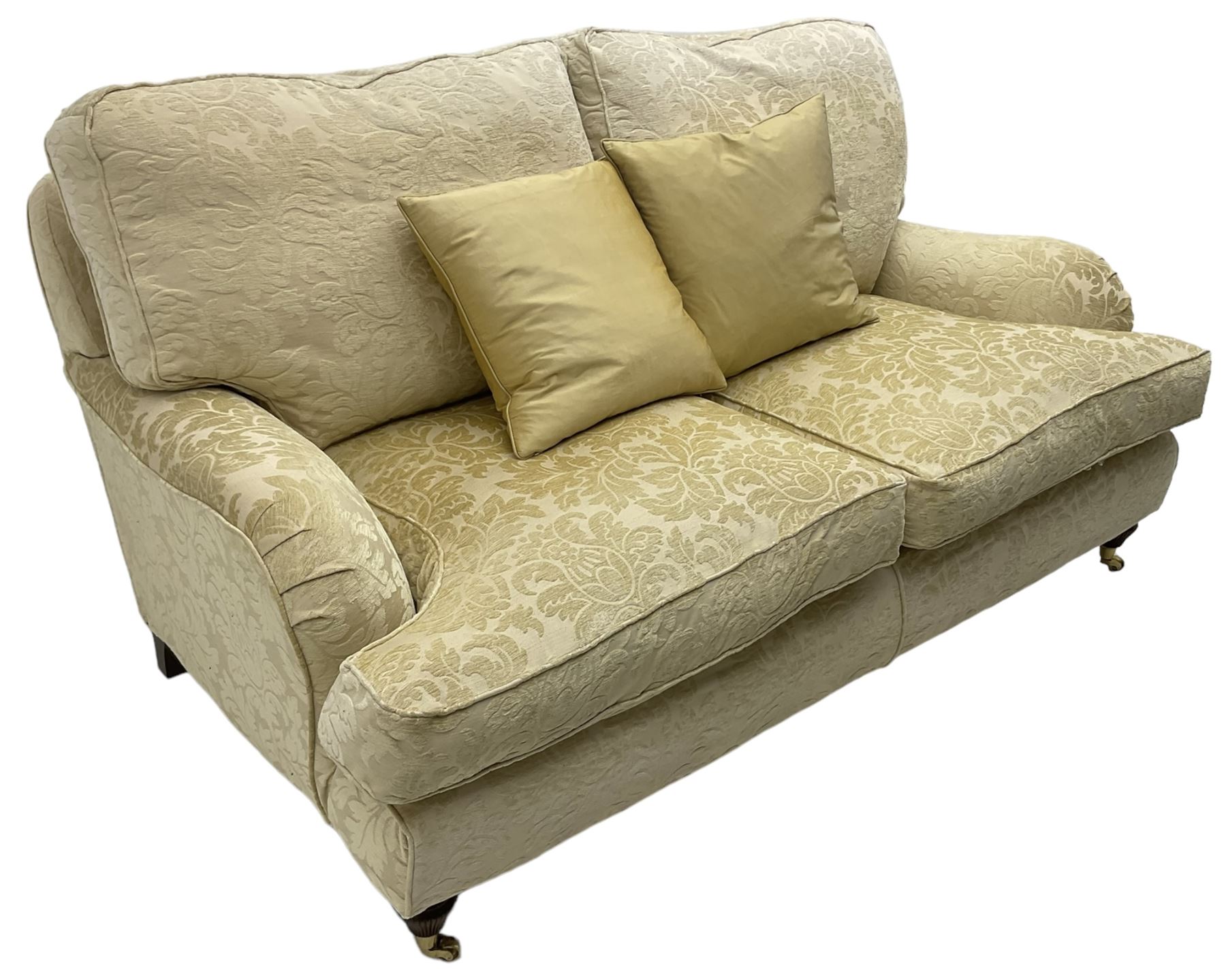 Multi-York - Howard shape two-seat sofa, upholstered in scrolling floral pattern loose covers, rolled arms, on turned front feet with brass cups and castors