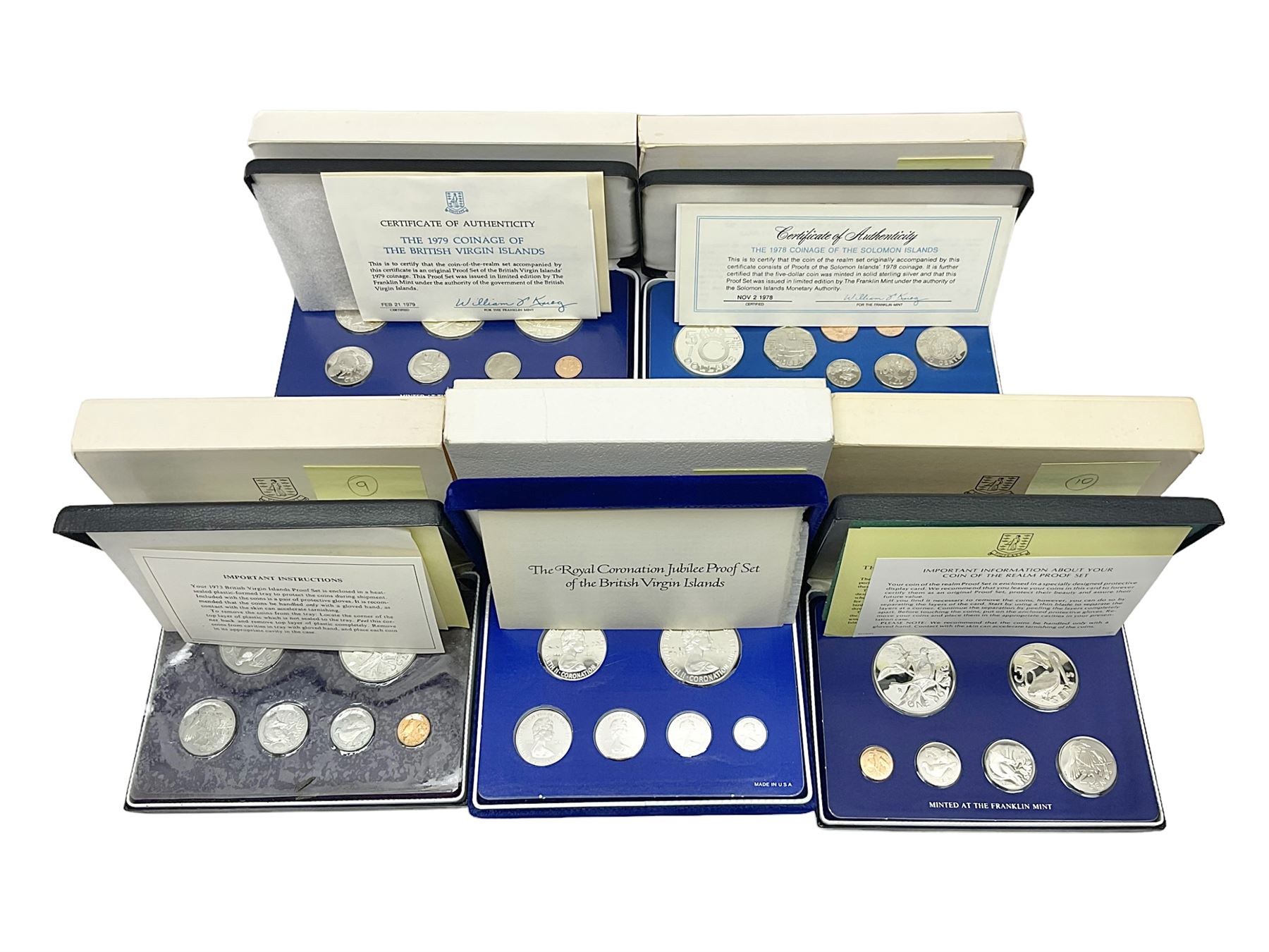 Four British Virgin Islands proof coin sets, comprising First Coinage of the British Virgin Islands 1973 proof six coin set, containing silver one dollar coin, 1977 and 1979 proof sets, containing high denomination silver coins, and The Royal Coronation Jubilee 1977 six coin silver proof set, each minted at the Franklin Mint, all cased with certificates, and a Solomon Islands 1978 proof seven coin set, containing silver five dollar coin, minted at the Franklin Mint, cased with certificate (5)