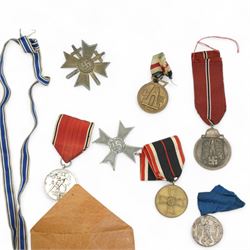 German Third Reich War Merit Cross, 1st class with swords, clasp marked '65', another without swords with citation and envelope of issue, 1914-18 Cross of Honour, Third Reich Mothers Cross, Faithful Service Cross and others