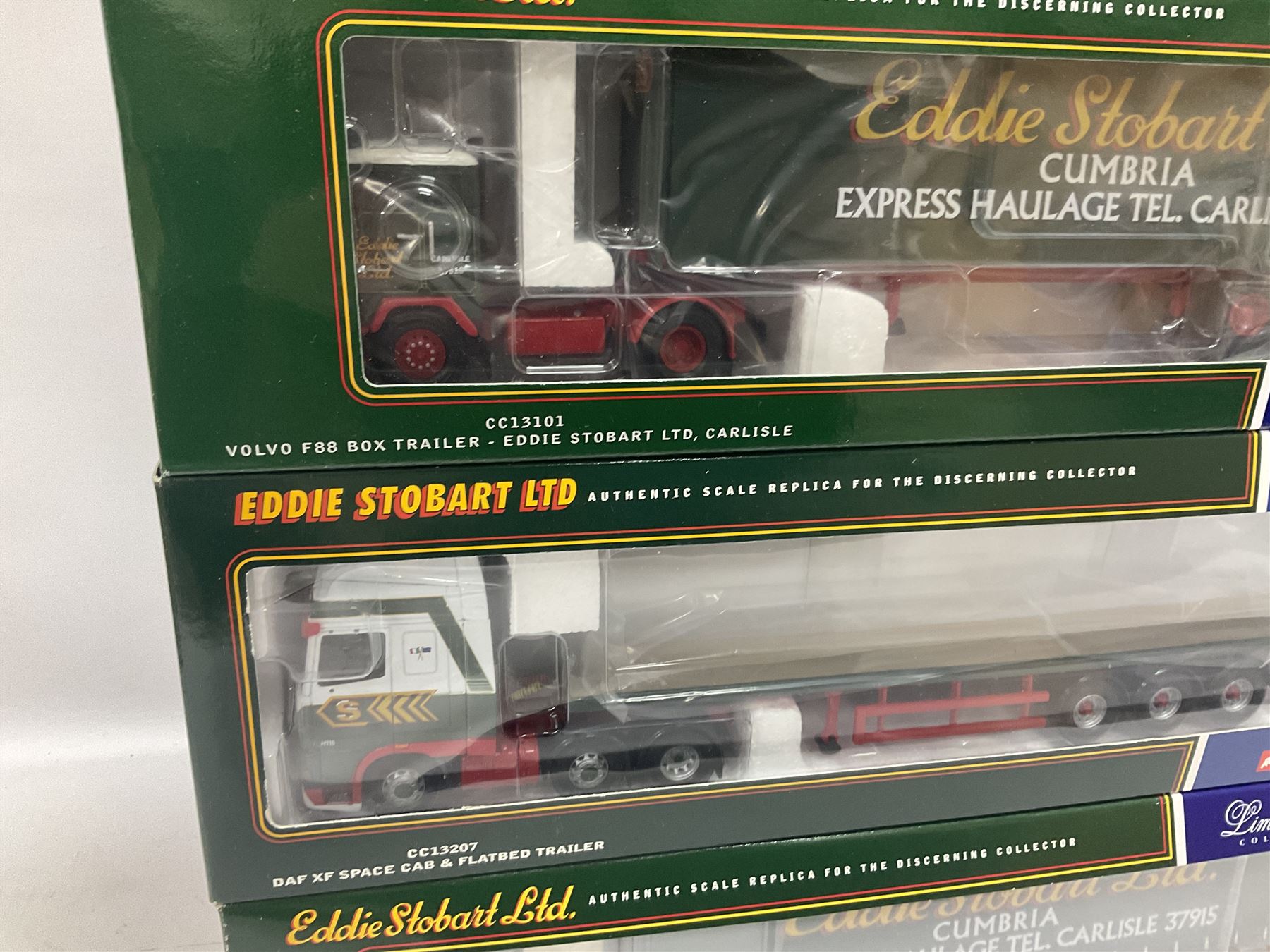 Corgi - four limited edition 1:50 scale Eddie Stobart heavy haulage vehicles comprising CC12802 Scania T-Cab Bulk Tipper; CC13207 DAF XF Space Cab and Flatbed Trailer; CC13101 Volvo F88 Box Trailer; and CC12607 Scammell Crusader Tautliner; all boxed (4)