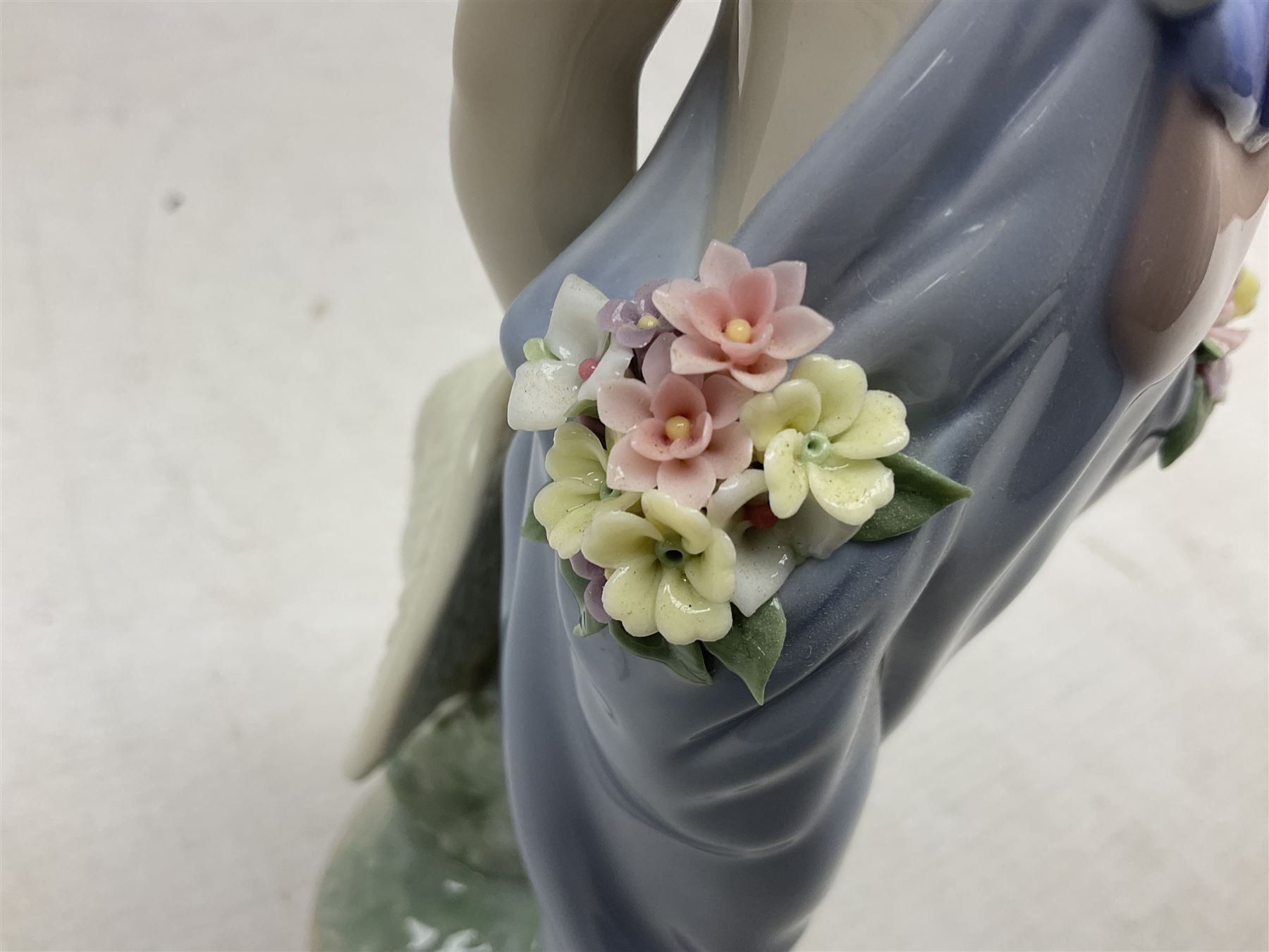 Three Lladro figures comprising, Pocket Full of Wishes no 7650, School Days no 7604 and Spring Bouquets no 7603, all with original boxes, largest example H26cm  