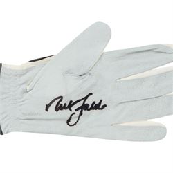 Signed golf memorabilia, to include 1988 US Masters Champion Augusta National flag, signed by Sandy Lyle, a golfing glove signed by Nick Faldo, two signed 2002 Ryder Cup prints, 1979 Masters scorecard signed by Fuzzy Zoeller displayed with a 1980 Masters scorecard signed by Seve Ballesteros, all framed, largest frame H60cm