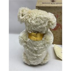 Modern Steiff teddy bear - The Millenium Bear No.34709 with golden pendant H32cm; in original box with paperwork; together with a Steiff ball-point pen in case sent to the vendor as compensation for a delay in receiving the bear.