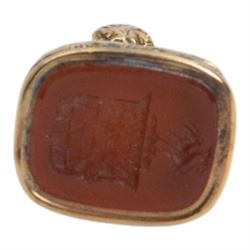 Late 18th/early 19th century 12ct gold fob seal, the carnelian matrix engraved with the Chichester family coat of arms, depicting a chequy shield beneath a crest of a heron with an eel in its beak, within a scrolling foliate mount, the sides detailed with a hound in chase and birds, H3cm

Provenance: By family descent from the Chichesters of Arlington Court, Devon; from the collection of Andrew Chichester Everitt.
