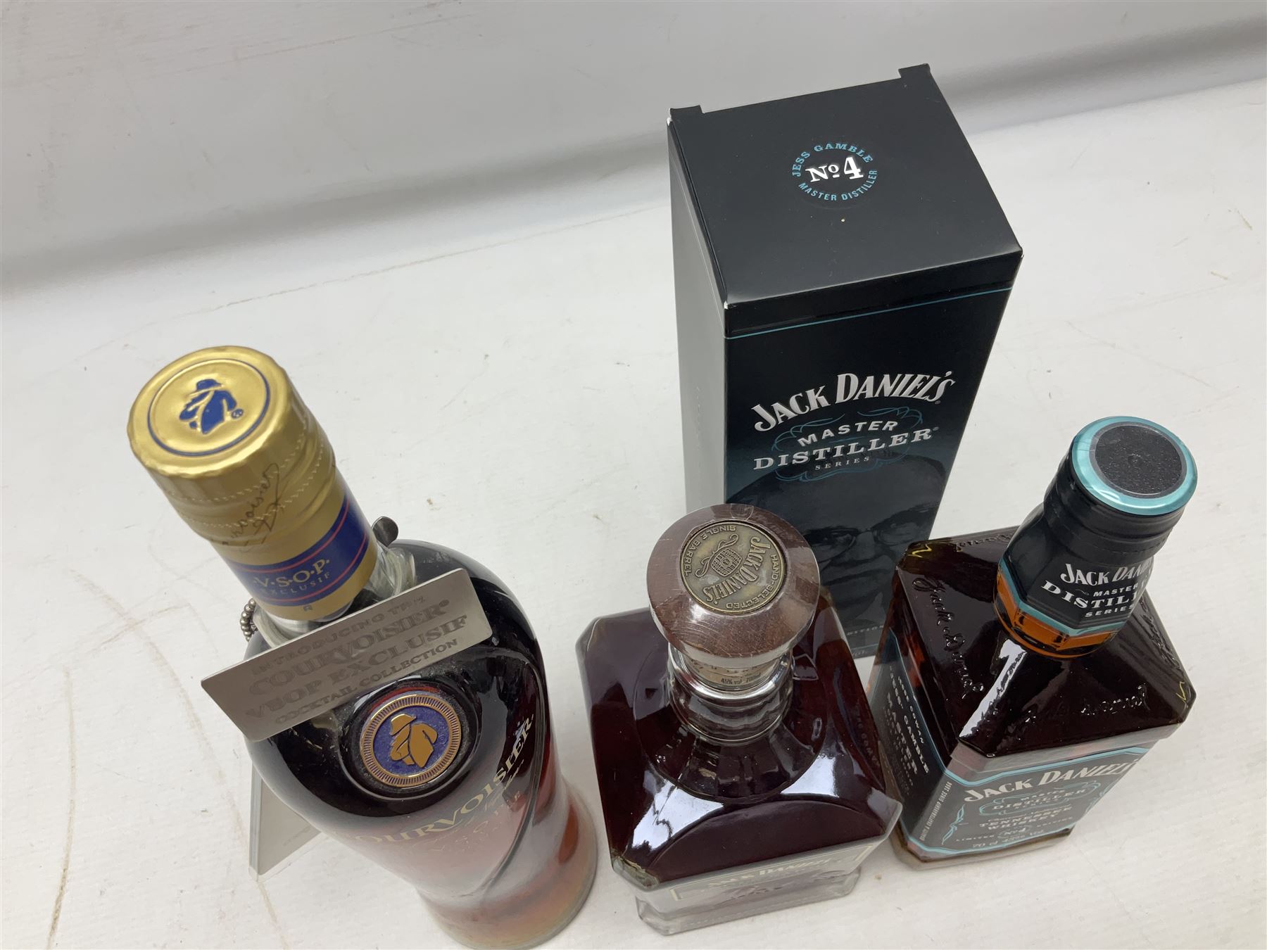 Jack Daniels, single barrel Tennessee whisky, 700ml, 45% vol, Jack Daniels, Tennessee whiskey master distiller series No.4, 700ml, 43% vol, and Courvoisier VSOP cognac, 70cl, 40% vol (3)