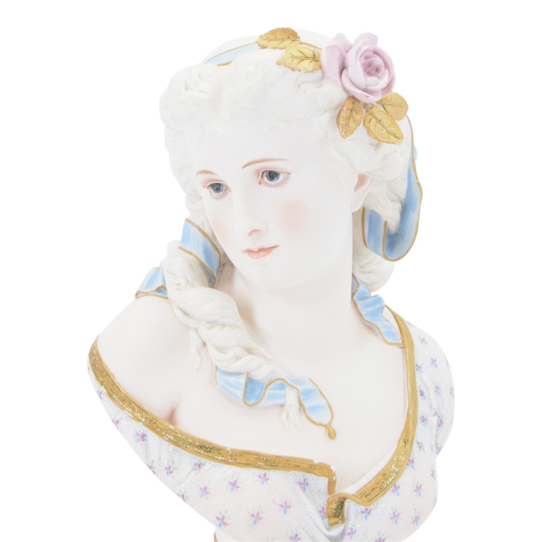 Late 19th century French Limoges bisque porcelain bust, by Henri Ardant, modelled as a young maiden with ribbon and rose in her hair, after A. Carrier, upon a blue socle base entitled 'Souvenir' in gilt, marked beneath, H37cm

