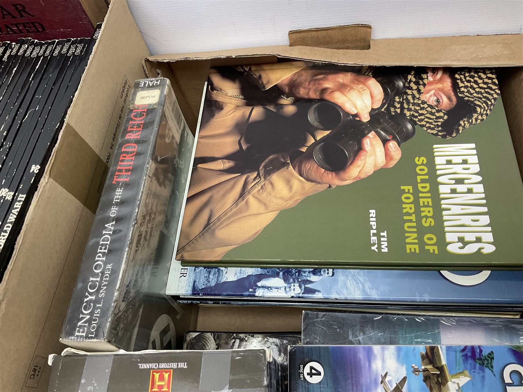 Three boxes of books, periodicals and DVDs of military interest with particular emphasis on WW2 including The History of World War Two in thirty original parts by Orbis, The D-Day Experience by Richard Holmes, The World War Two Databook, The World at War, Special Forces etc