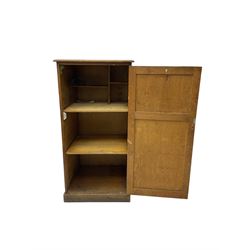 Early 20th century oak cupboard, fitted with two shelves, on plinth base