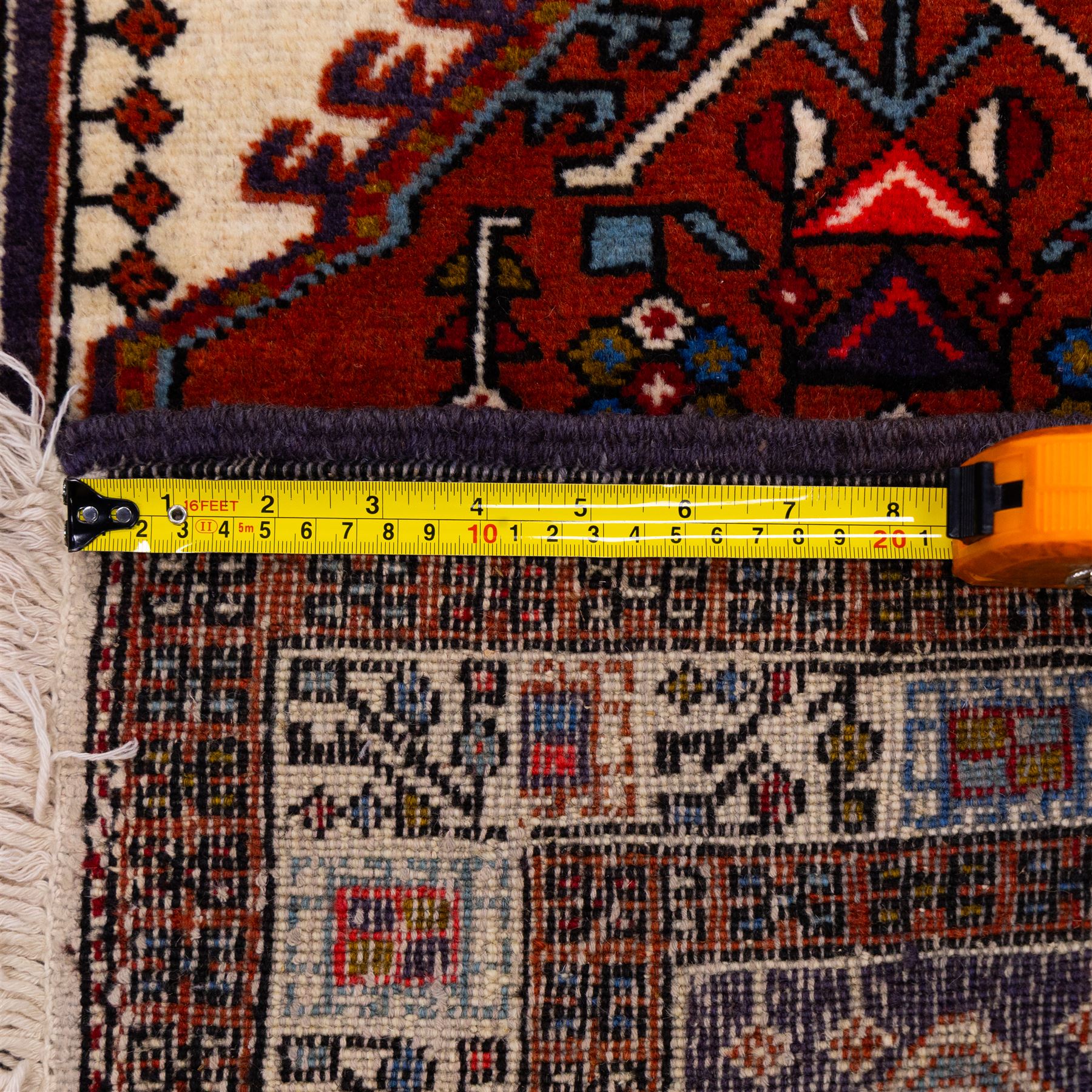 North West Persian Ardebil hand-knotted runner, ivory field decorated with row of large hexagonal medallions enclosing stylized geometric and floral motifs, linked by angular devices, within multiple geometric borders, cotton fringe ends 