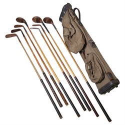 Set of eight Hickory golf clubs with a canvas golf bag