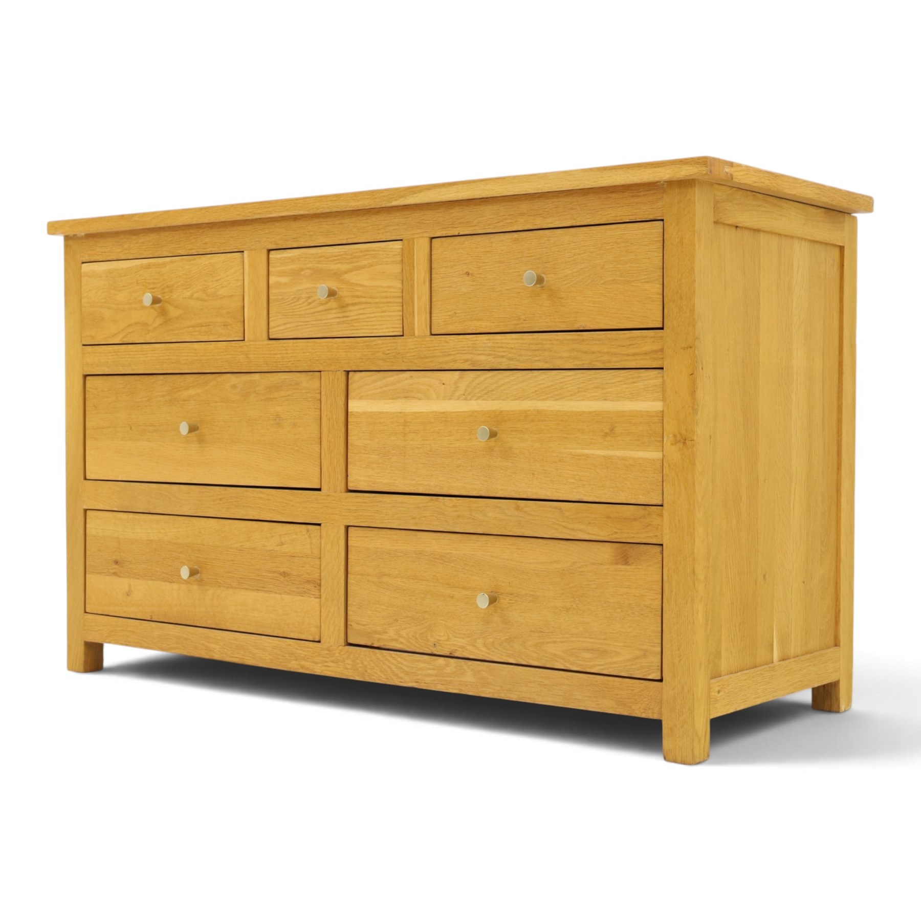 Contemporary light oak chest, rectangular top fitted with three short over four long drawers, on square feet