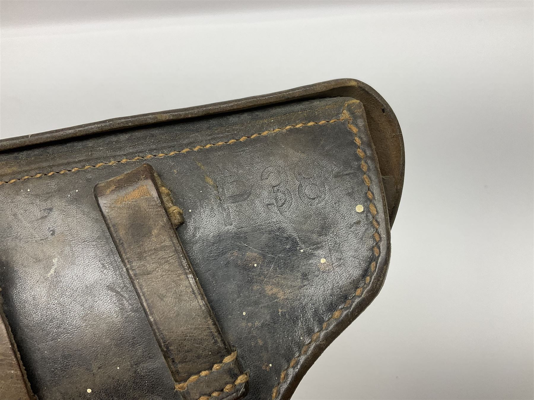 WWII German brown leather holster with side magazine pouch for a Walther P.38 semi-automatic pistol, stamped P38 and OWX 1941 on back L24.5cm