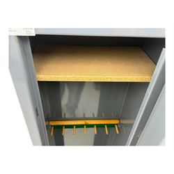 Mountain & Sowden Ltd - painted grey steel construction with single door secured by 7 lever lock, interior fitted with green felt-lined barrel rest, fixed shelf