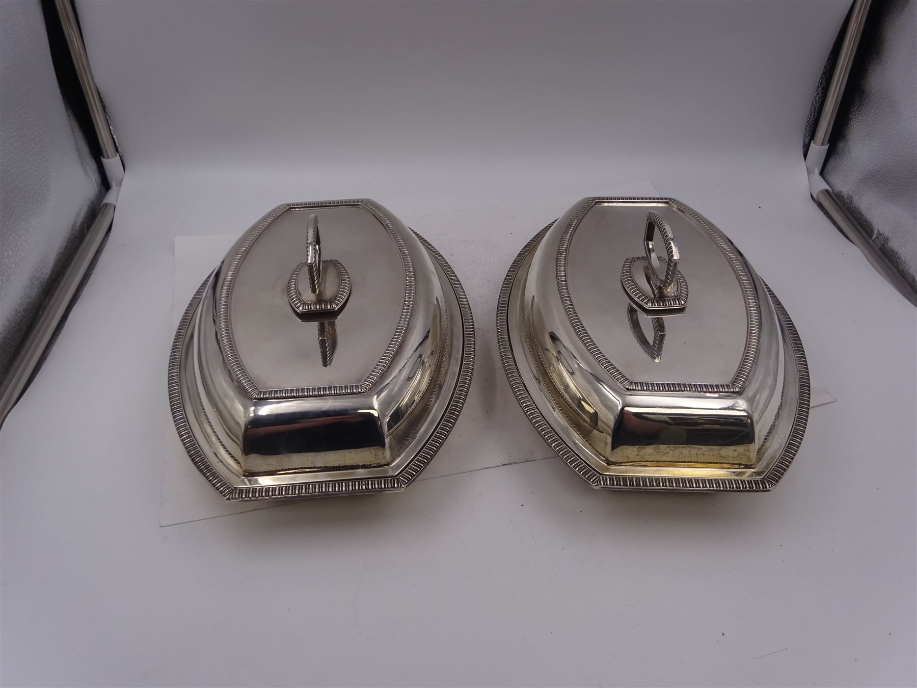 Pair of 1930s silver serving dishes with covers, each with removable handles, hallmarked Barker Brothers Silver Ltd, Birmingham 1935, L27.5cm, H12cm