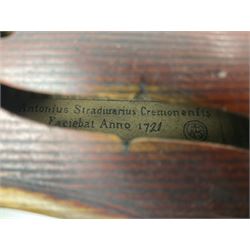 Late 19th century French three-quarter size 'Conservatory' violin with 34cm two-piece maple back and ribs and spruce top, the peg box inscribed 'Conservatory Violin Straduari', bears label 'Antonius Stradiuarius Cremonensis Faciebat Anno 1721' L55.5cm overall; in ebonised wooden 'coffin' case; and Saxony violin c1900 with 36cm two-piece maple back and ribs and spruce top; bears label 'Antonius Stradivarius Cremonensis Faciebat Anno 17**' L59cm overall; in carrying case (2)