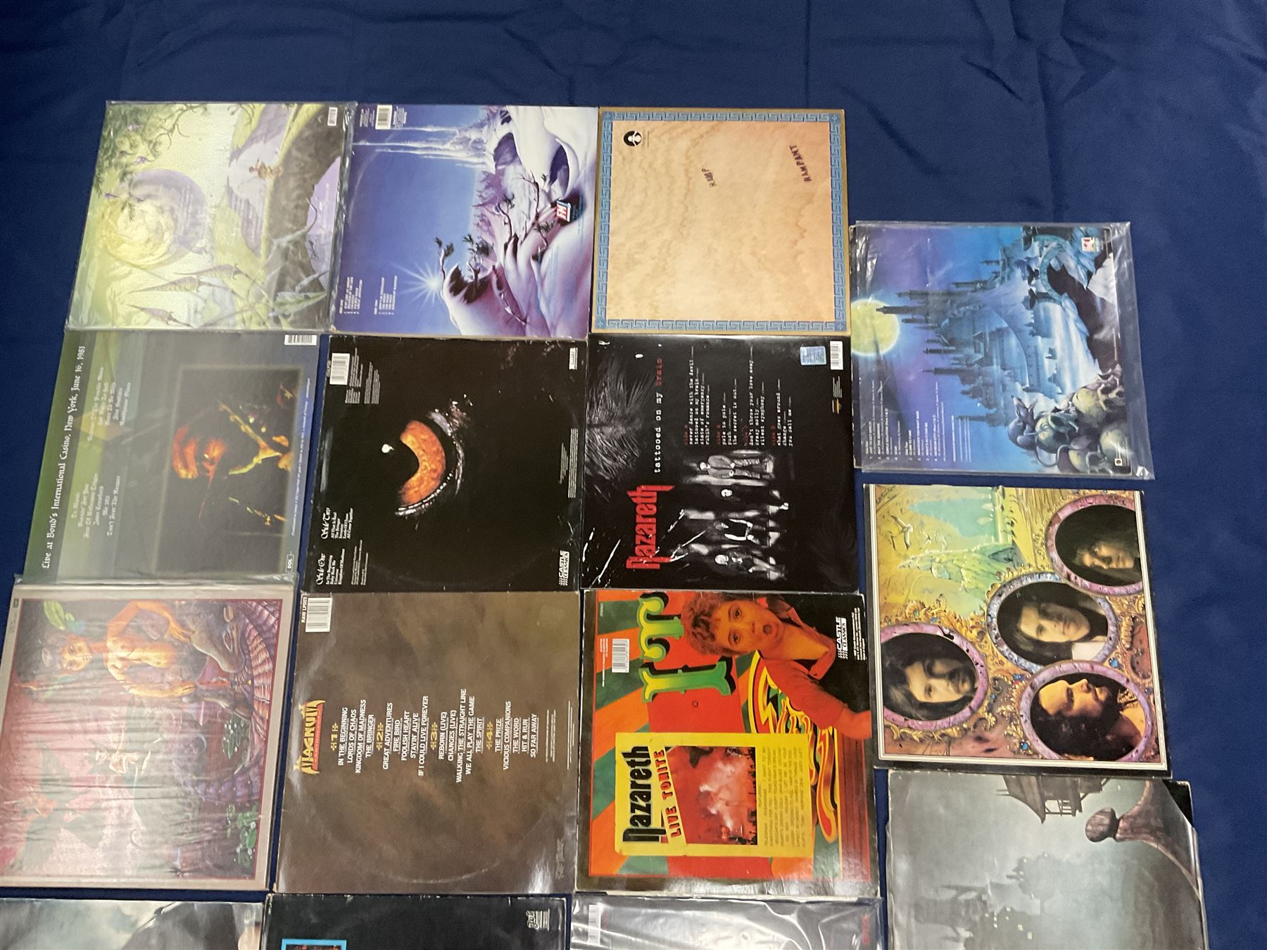 Rock, hard rock and progressive rock vinyl LPs including Greenslade 'Bedside manners are extra', 'Time and Tide', Nazareth 'No mean city', 'Close enough for Rock 'n' Roll', 'tattooed on my brain', 'Rampant', 'expect no mercy', Magnum 'Marauder', 'Anthology', 'Kingdom of Madness', 'Lost On The Road To Eternity' etc (19)