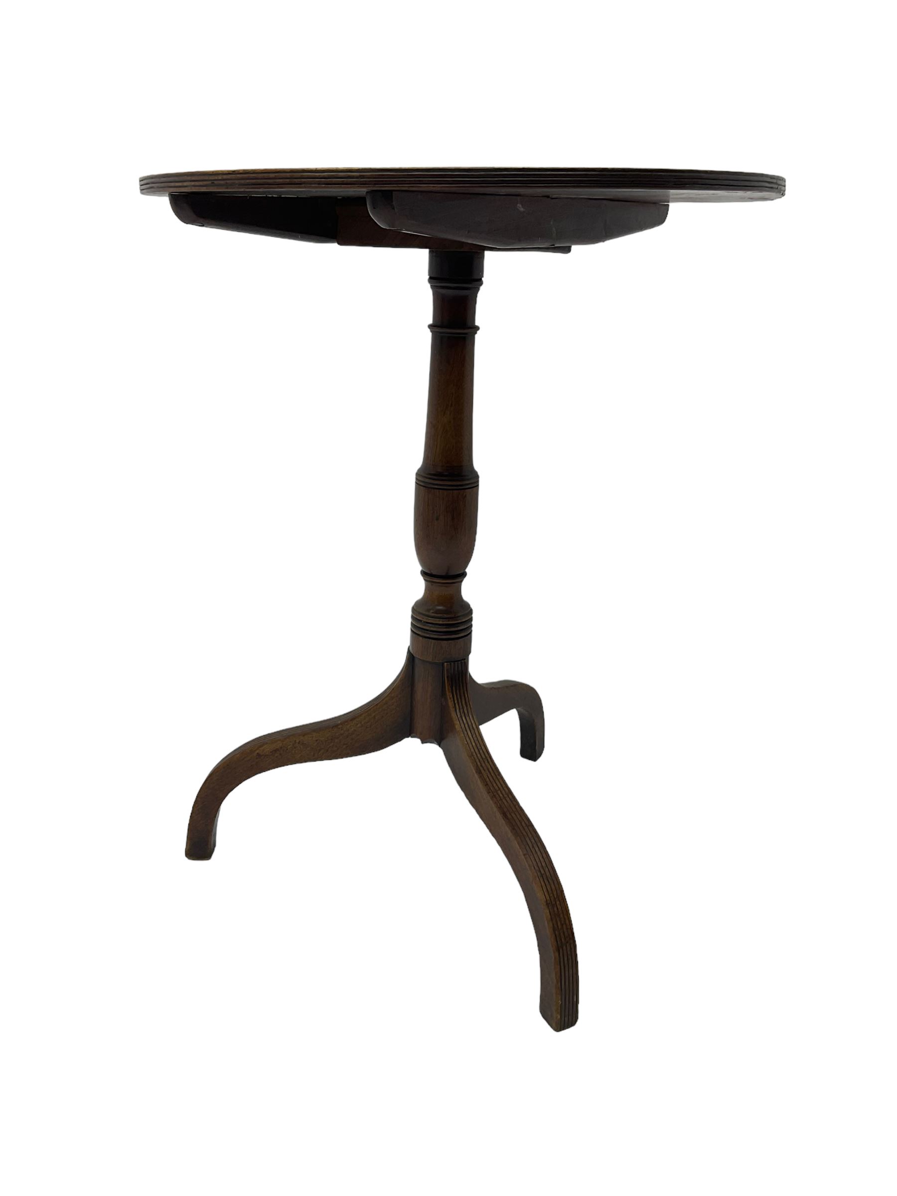 Early 19th century mahogany tilt-top pedestal table, the circular top with reeded edge, raised on turned support with reeded tripod base