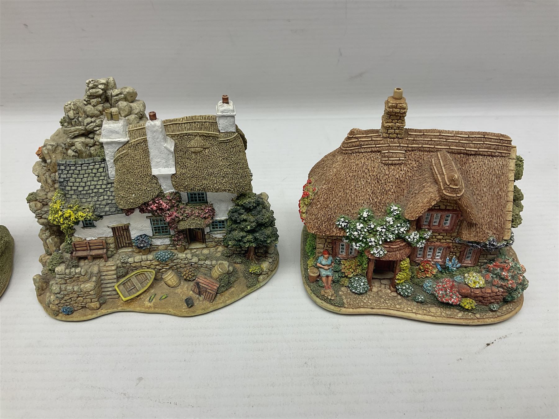 Eighteen Lilliput Lanes, including The Penny Farthing, The Pigsty, Borrowdale School, Fairy Cake Tearoom, An Apple a Day,Ladybird Cottage etc, all with original boxes 