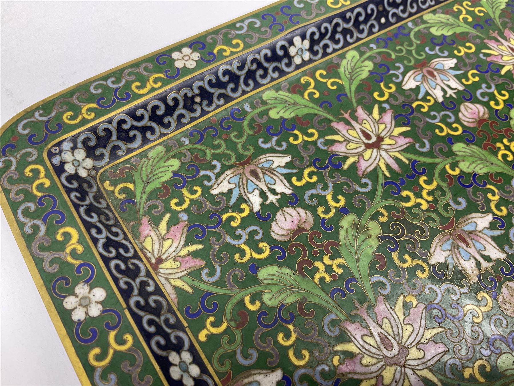 20th century Chinese cloisonne enamel smoking set, comprising two ashtrays, box and tray, with floral and foliate scrolling on green ground