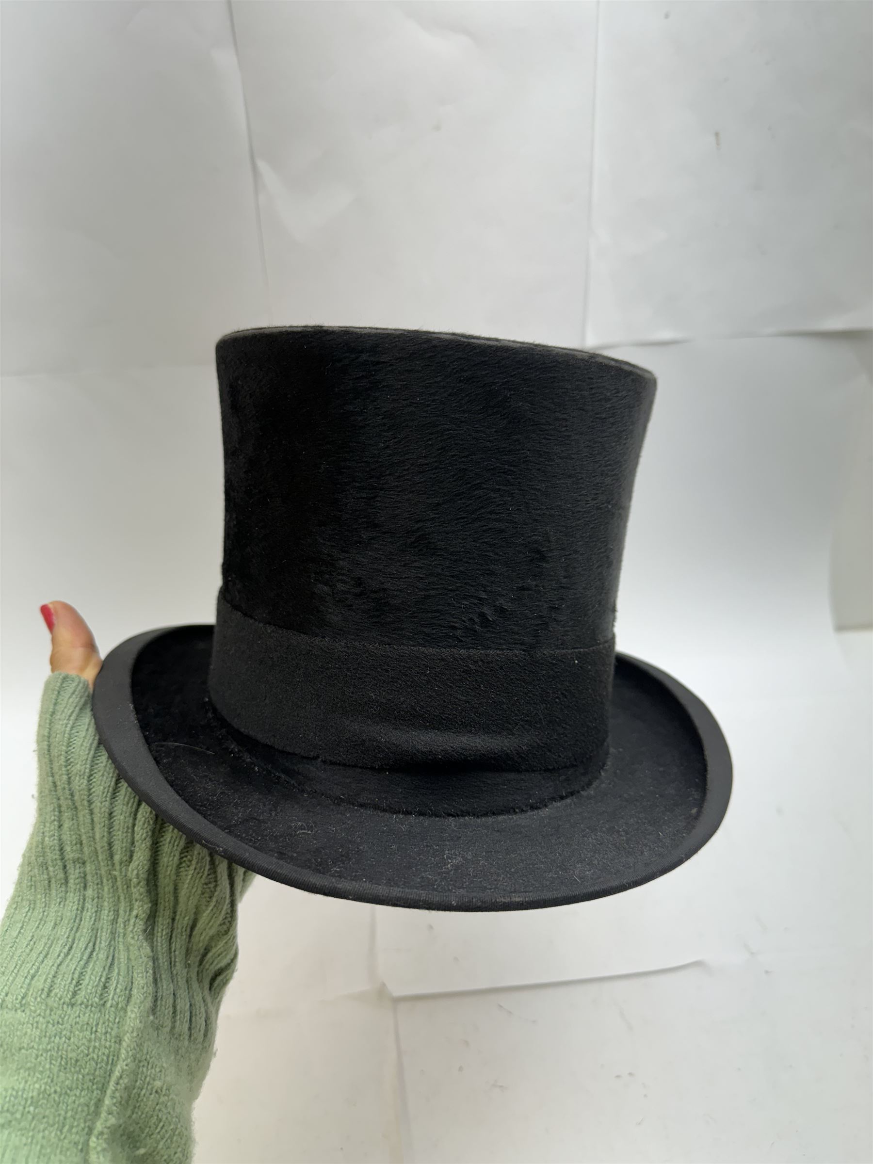 Akubra pure fur felt trilby hat, together with another trilby and two top hats, one by Woodrow and one by Dunn & Co