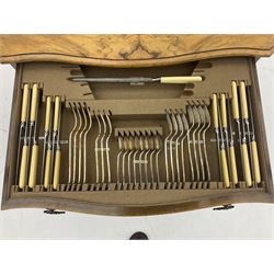 Canteen of Robert F. Mosley Rusnorstain silver-plate cutlery, eight settings- complete, in walnut two drawer canteen table on cabriole legs 