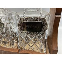 Edwardian silver plate mounted oak tantalus, containing three square sided cut glass decanters, complete with key, H33cm