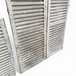 Five 19th century full height French Chateau louvre doors, pitch pine painted in cream finish, two having iron rod hinges, dimensions approx.