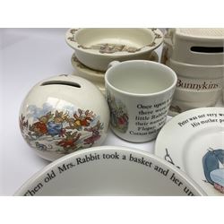 Collection of Royal Doulton Bunnykins and Wedgwood Peter Rabbit nursery ware, including cups, bowls, money boxes, etc 