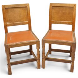 Mouseman - pair of 1940's adzed and panelled oak chairs, the rectangular adzed back-panel ...