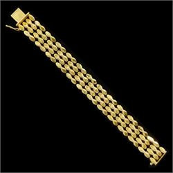 18ct gold fancy link bracelet, outer polished links spaced by two rows of flower head desi...